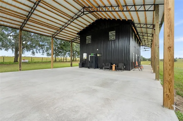 a view of a house with backyard and porch
