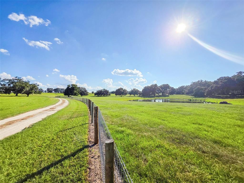 23220 Northwest 27 Street Morriston, FL 32668 - Photo 36 of 44 a view of a golf course with a lake view