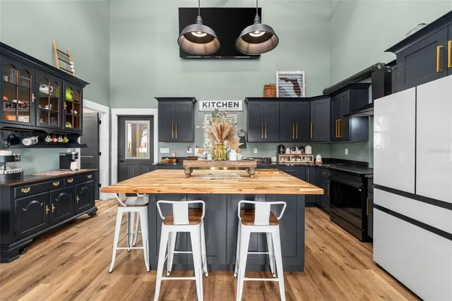a kitchen with a dining table and chairs
