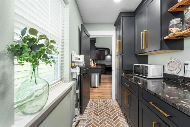 a kitchen with granite countertop lots of counter top space