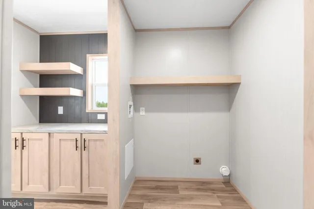 a view of kitchen with furniture and wooden floor