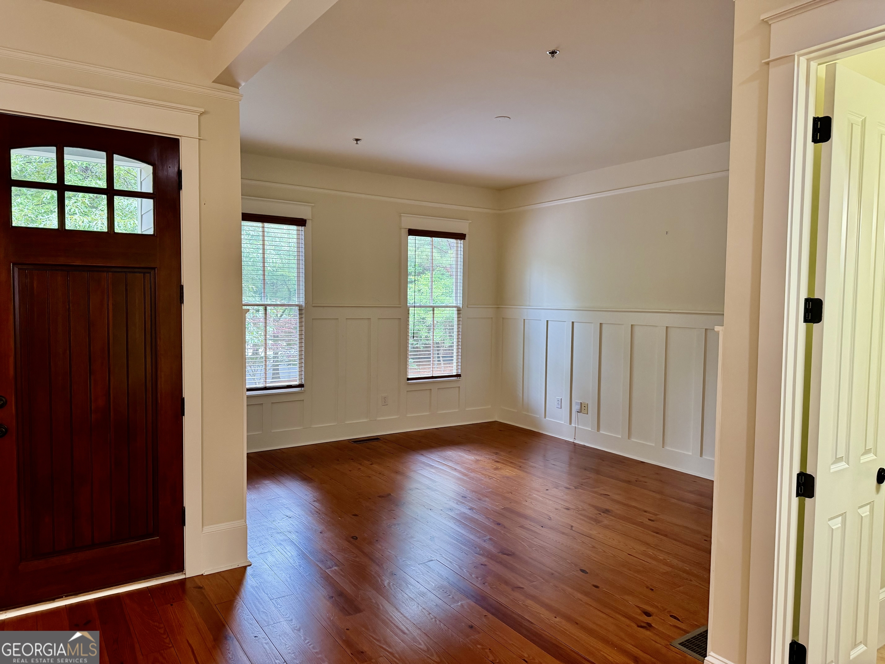25 Charter Oak Drive Athens, GA 30607 - Photo 7 of 19 an empty room with wooden floor and windows