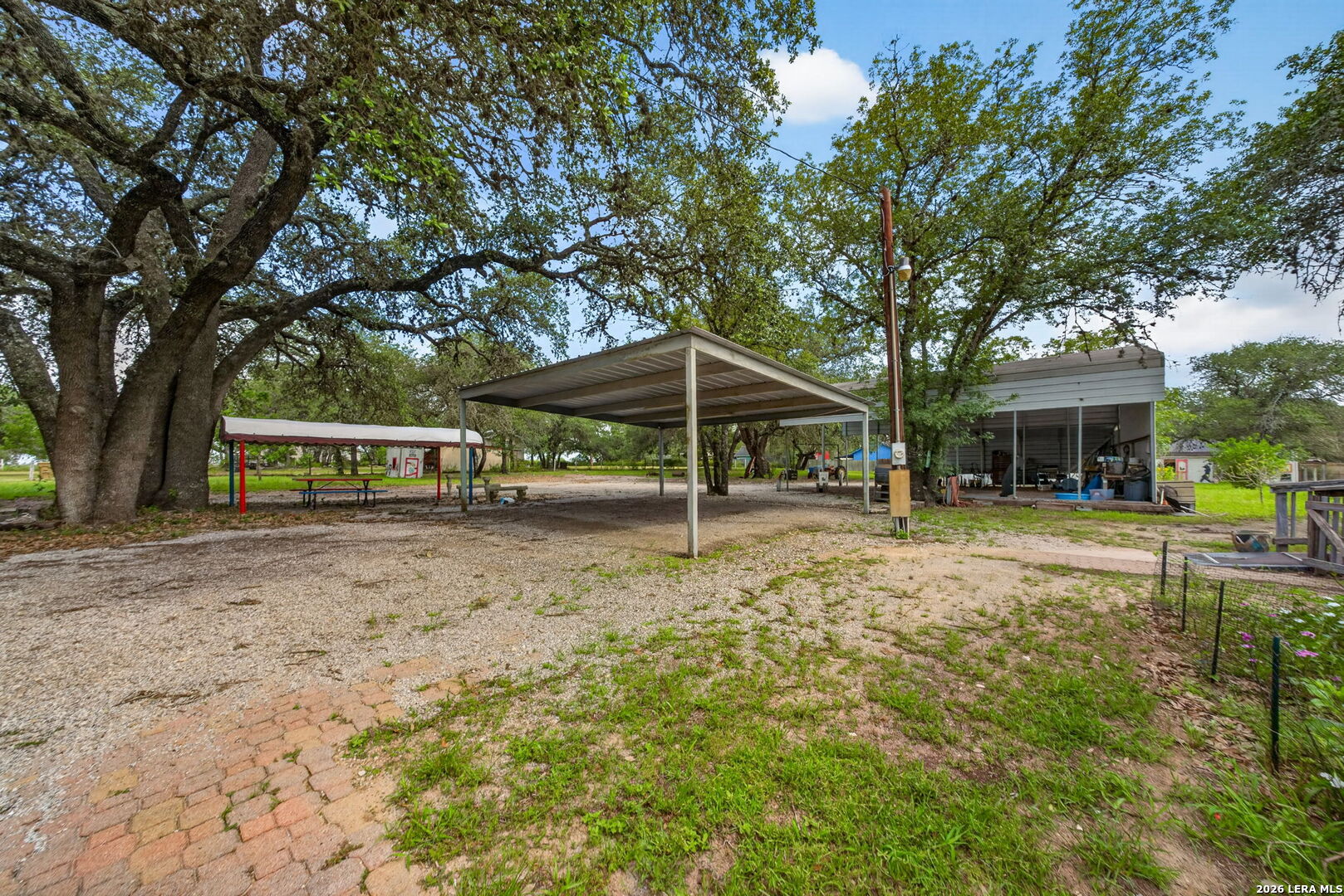 23398 Mathis Road Elmendorf, TX 78112 - Photo 10 of 18 a view of a house with backyard and sitting area