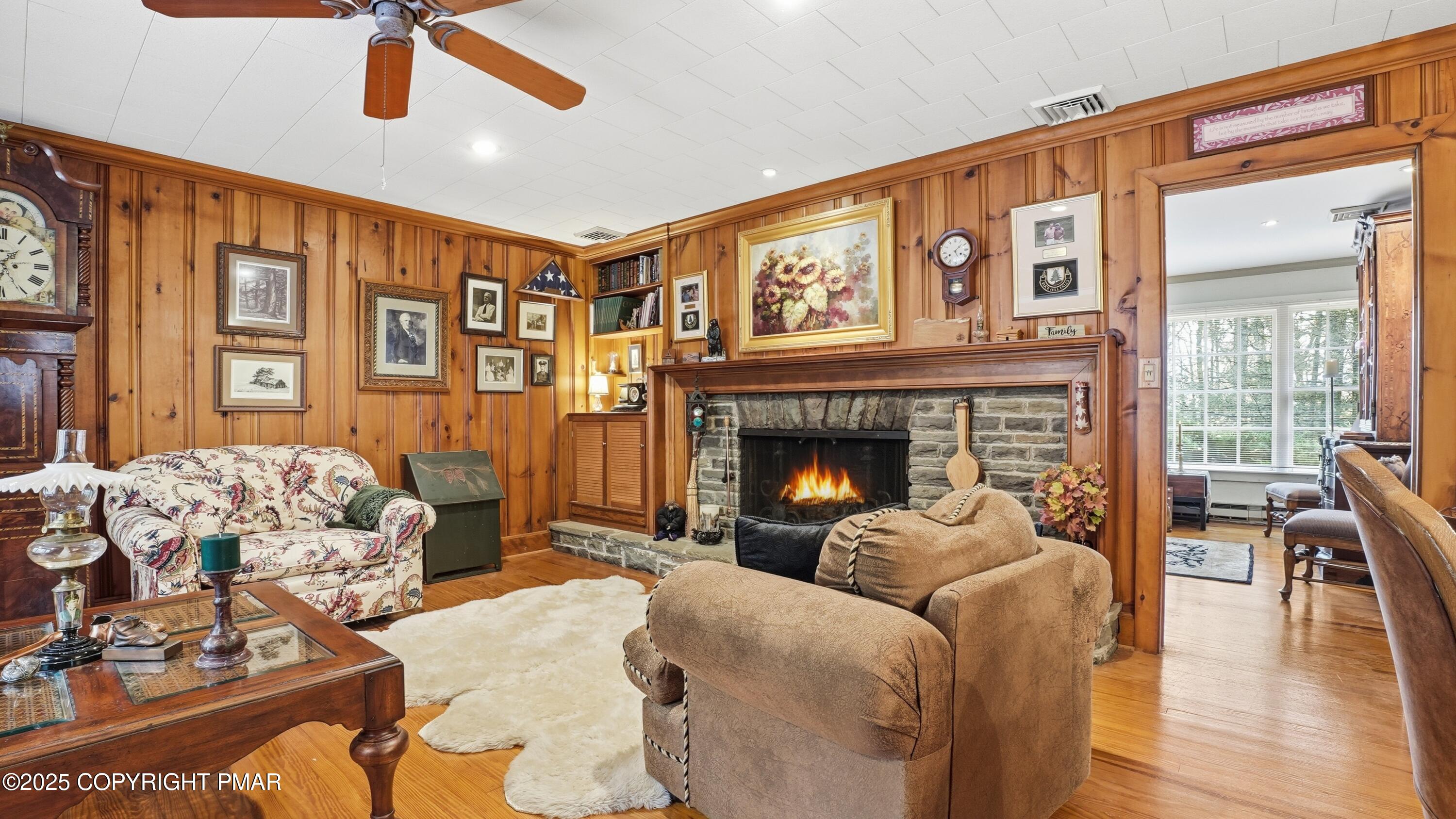 519 Pheasant Lane Cresco, PA 18326 - Photo 11 of 79 a living room with furniture and a fireplace