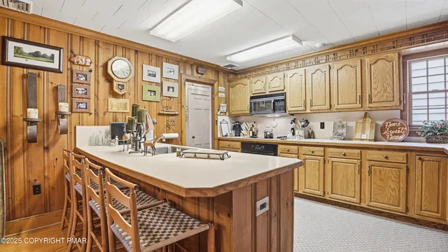 a kitchen with stainless steel appliances granite countertop a sink and cabinets