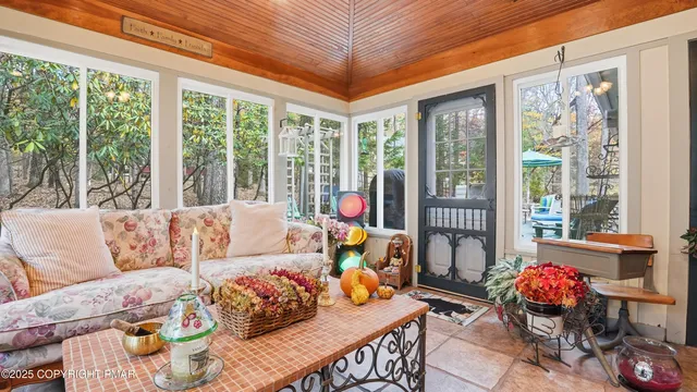 a room with furniture and a painting on the wall