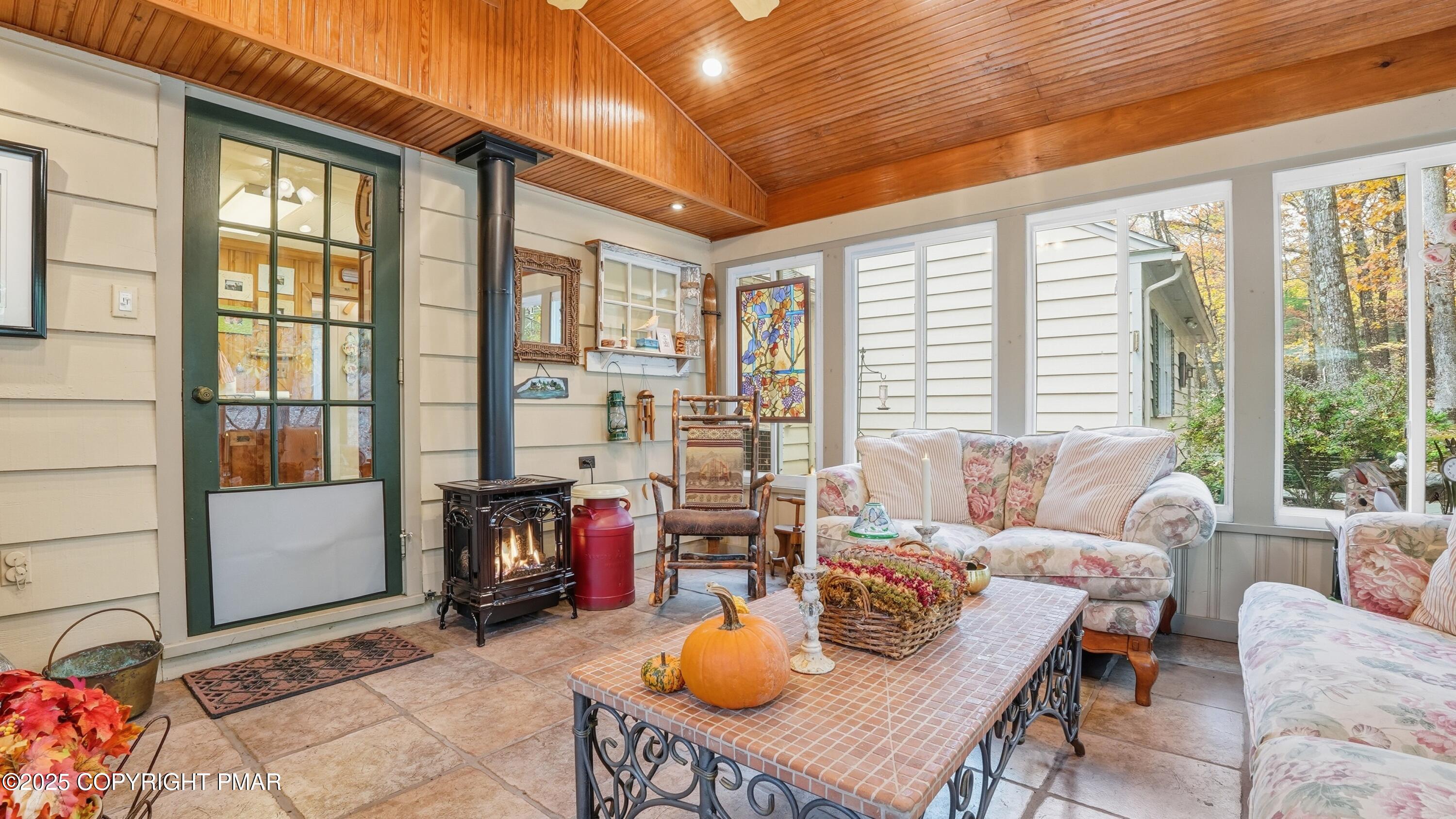 519 Pheasant Lane Cresco, PA 18326 - Photo 24 of 79 a living room with furniture and a floor to ceiling window
