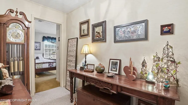 a bathroom with a sink a mirror a toilet and a window
