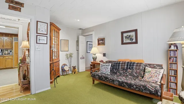 a bedroom with two beds and a large window