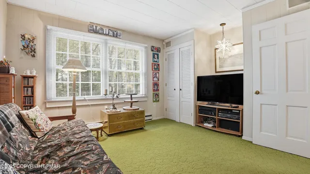 a view of a livingroom with furniture hardwood floor and a living room