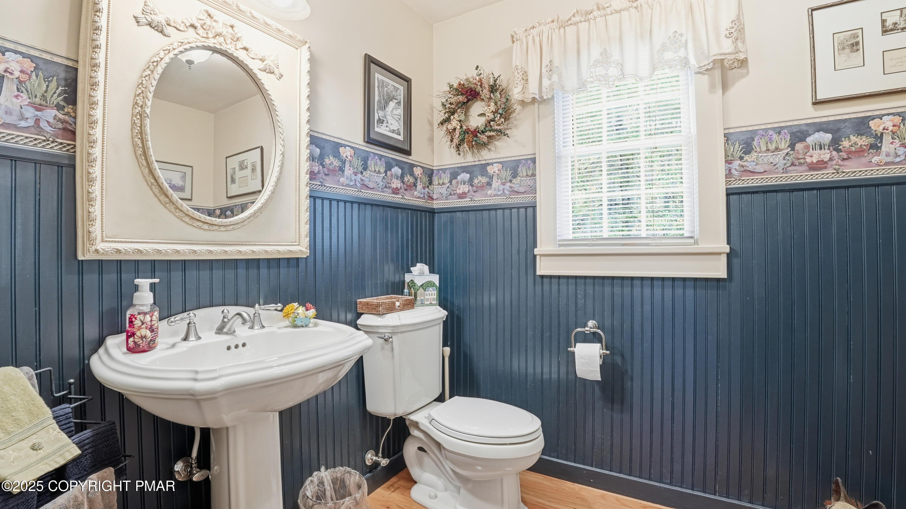 519 Pheasant Lane Cresco, PA 18326 - Photo 40 of 79 a bathroom with a sink a mirror a toilet and a window