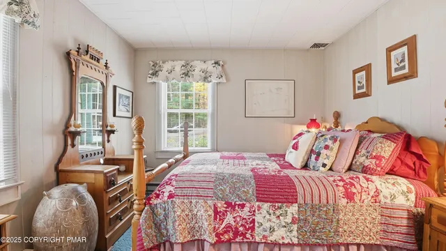 a view of house with a yard