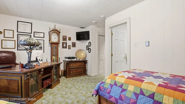 a view of a house with a yard and potted plants