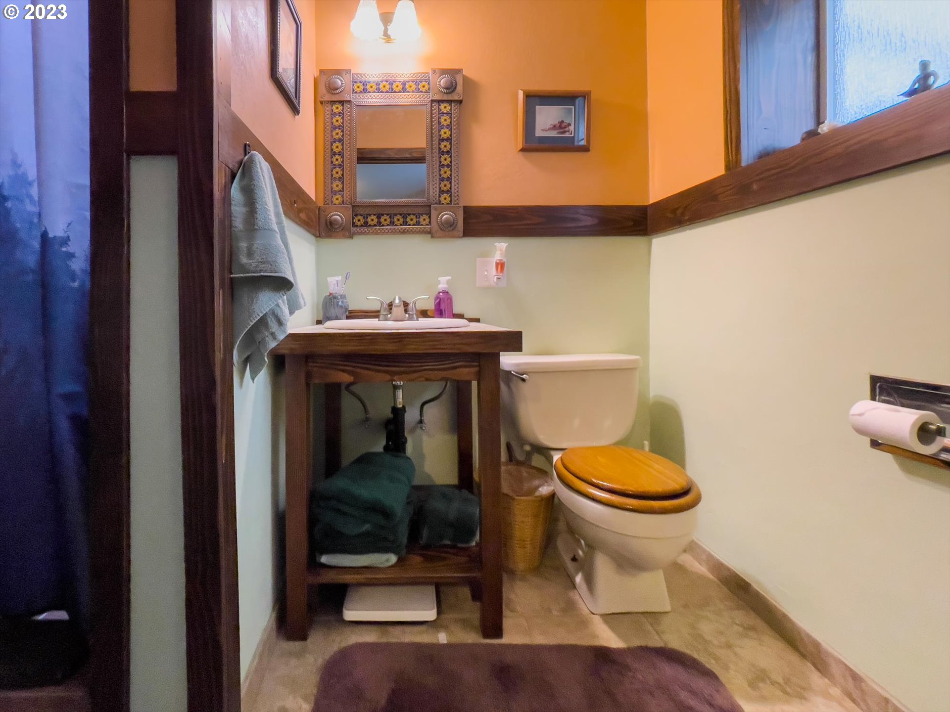 100 South 6th Street Lakeside, OR 97449 - Photo 11 of 42 a bathroom with a toilet and a mirror