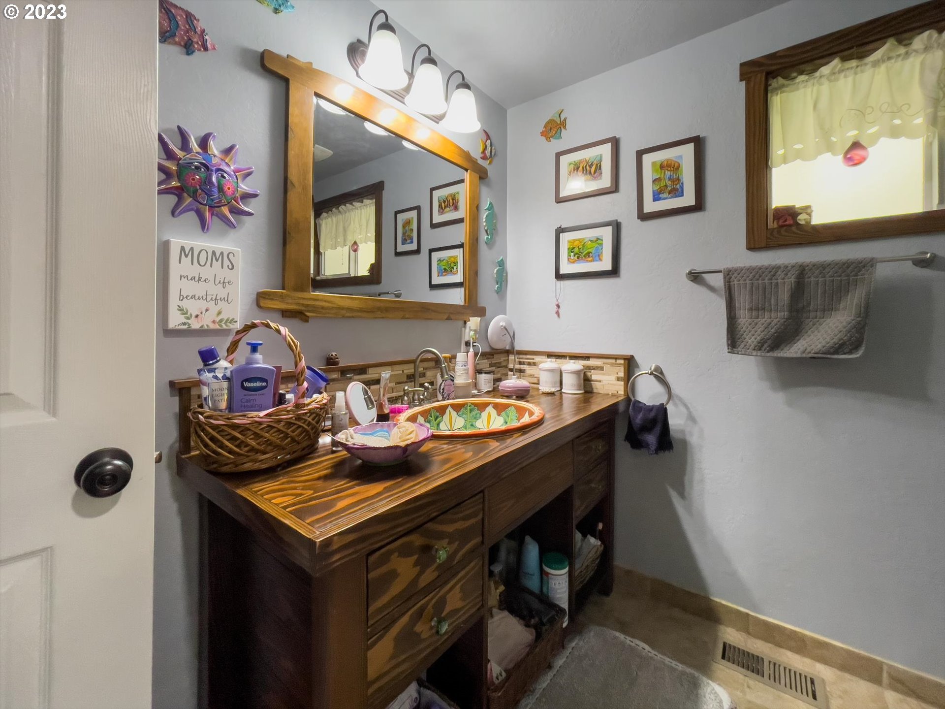 100 South 6th Street Lakeside, OR 97449 - Photo 13 of 42 a view of a dining room with furniture and a chandelier
