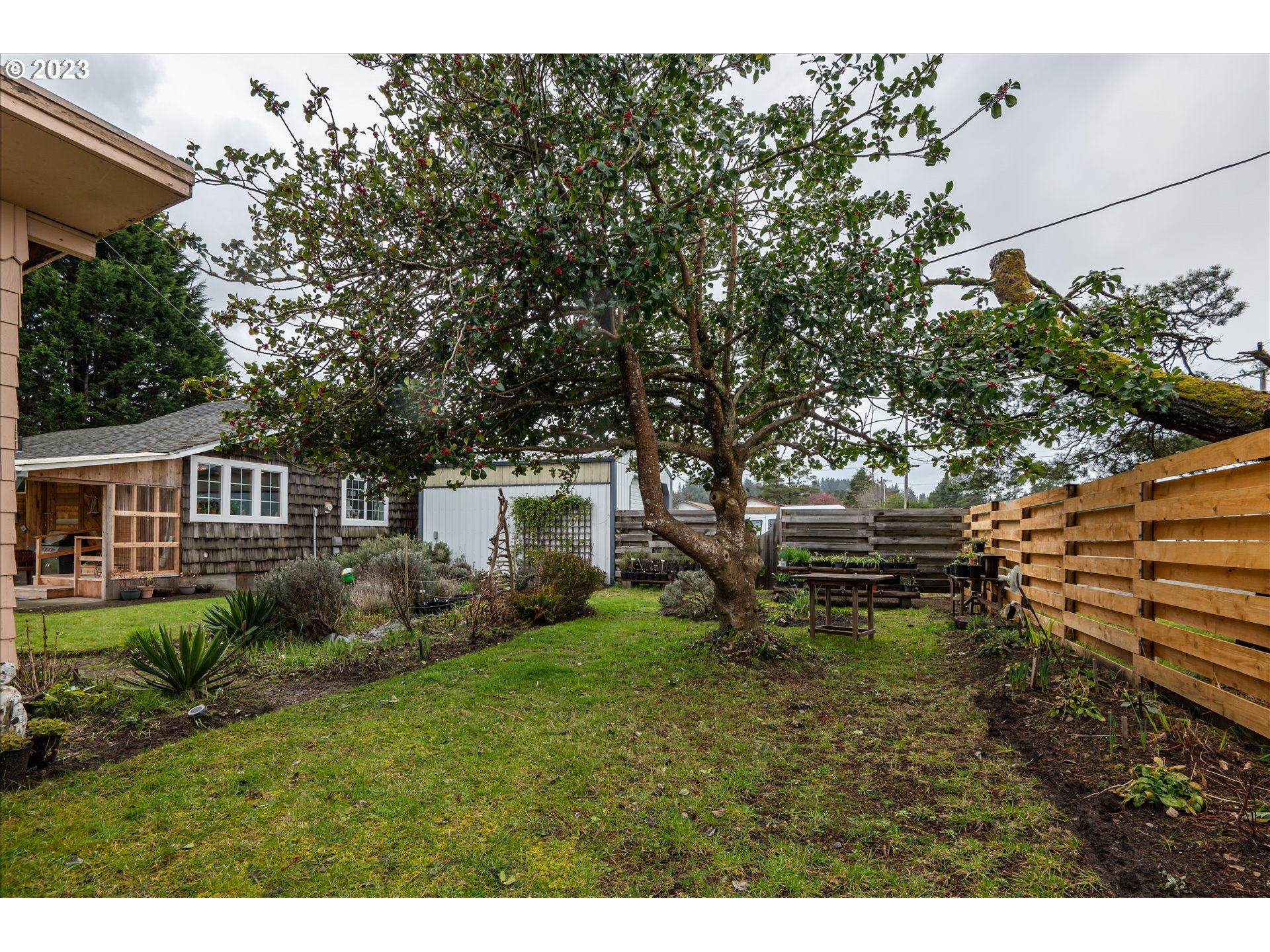 100 South 6th Street Lakeside, OR 97449 - Photo 23 of 42 a backyard of a house with lots of green space