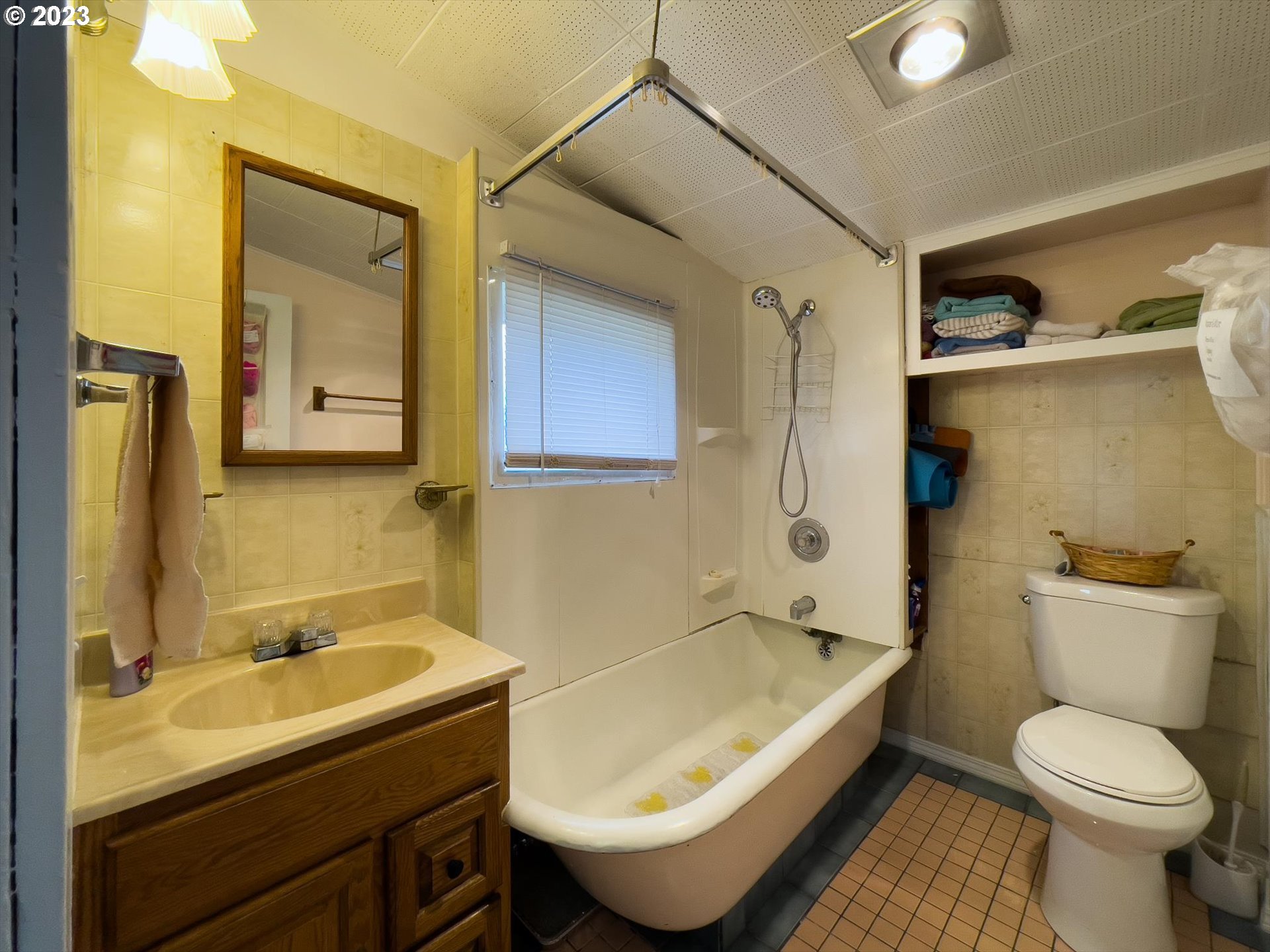 100 South 6th Street Lakeside, OR 97449 - Photo 29 of 42 a bathroom with a sink and mirror with toilet
