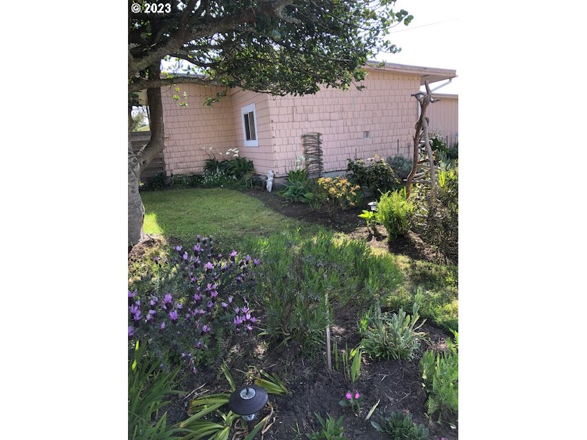 100 South 6th Street Lakeside, OR 97449 - Photo 33 of 42 a view of a house with a backyard