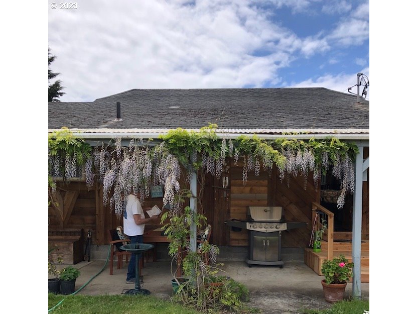 100 South 6th Street Lakeside, OR 97449 - Photo 35 of 42 a view of a chairs and table in patio with potted plants