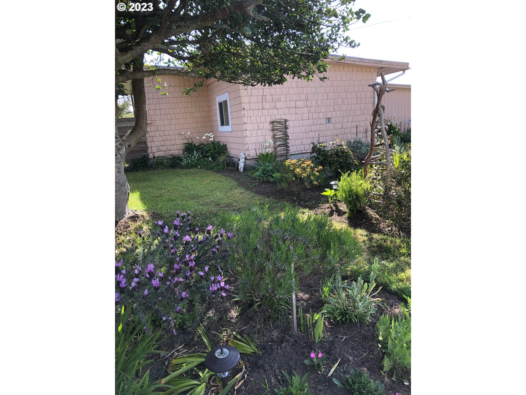 100 South 6th Street Lakeside, OR 97449 - Photo 39 of 42 a view of a house with a backyard