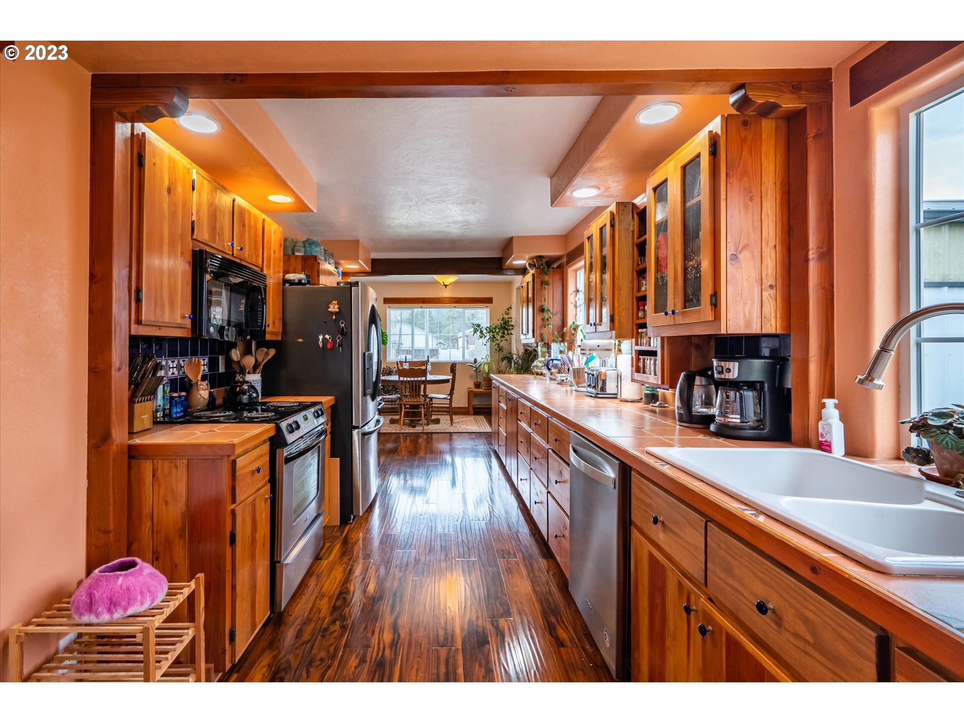 100 South 6th Street Lakeside, OR 97449 - Photo 5 of 42 a very nice looking room with wooden floor and furniture
