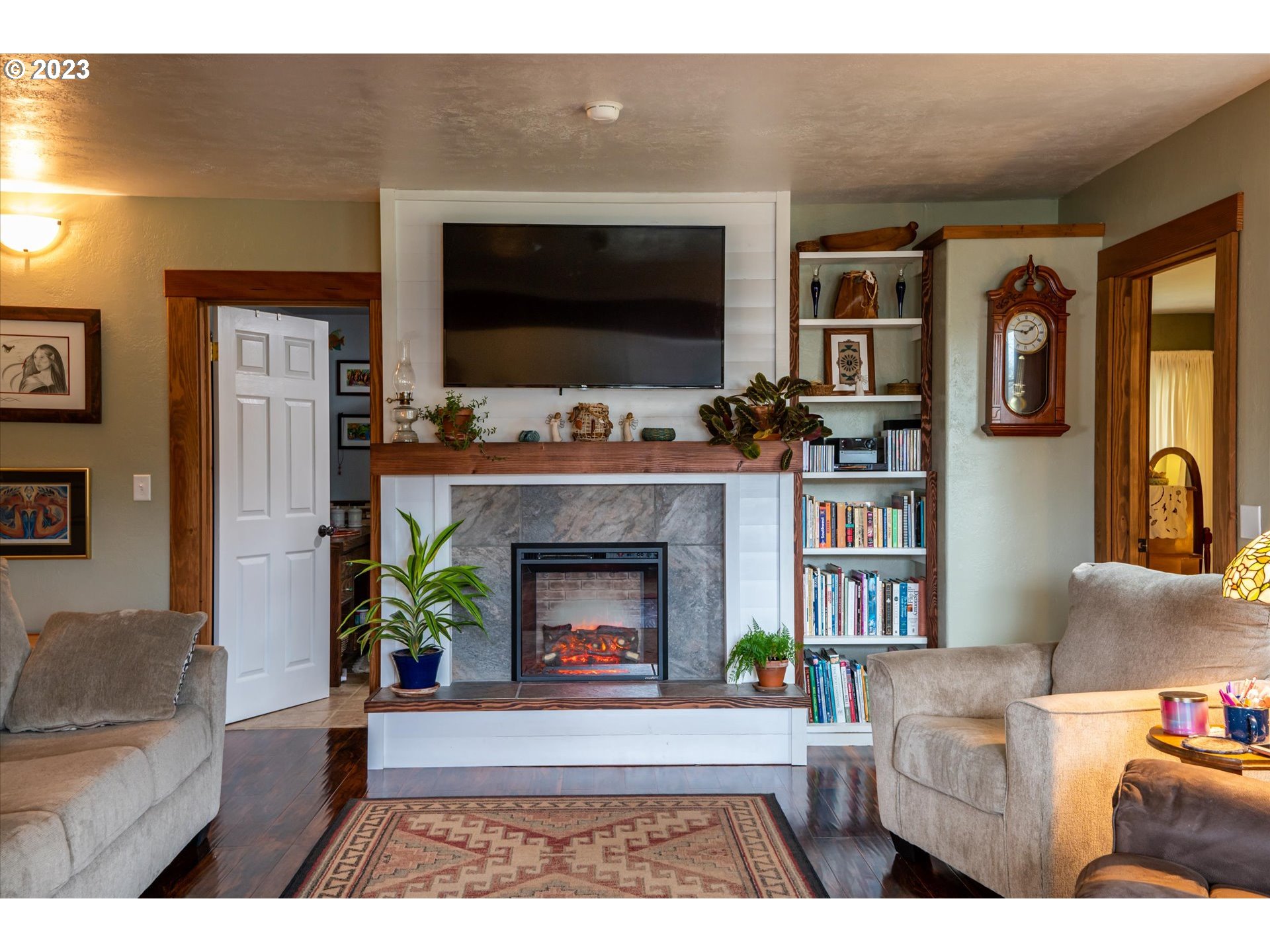 100 South 6th Street Lakeside, OR 97449 - Photo 8 of 42 a living room with furniture and a flat screen tv