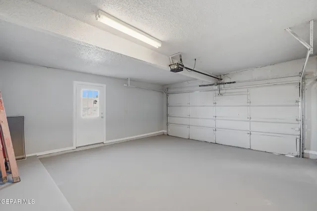 an empty room with a empty space and windows