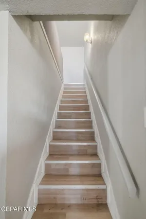 a view of staircase with white walls