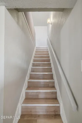 a view of staircase with white walls