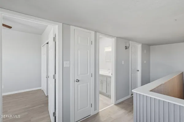 a spacious bathroom with a toilet sink and mirror