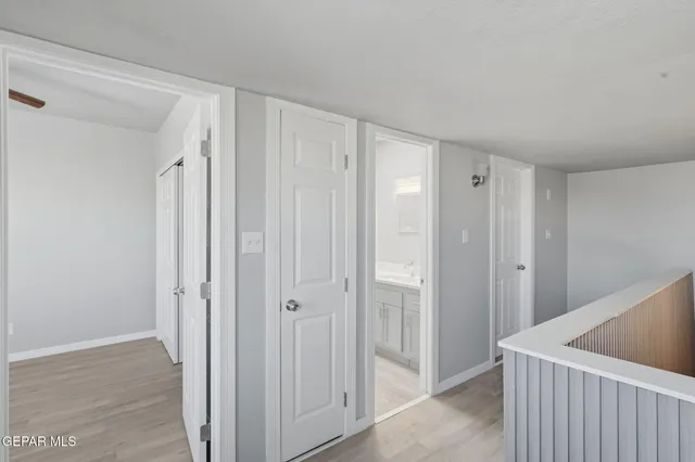 a spacious bathroom with a toilet sink and mirror