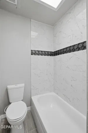 a bathroom with a shower and a bathtub