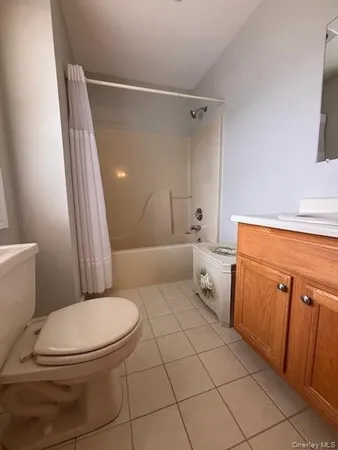 a bathroom with a toilet sink and vanity