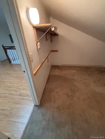 a view of a room with stairs and wooden floor