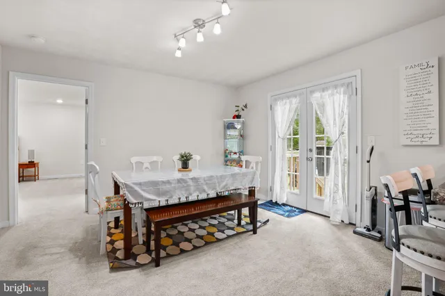 a kitchen with granite countertop stainless steel appliances and wooden cabinets