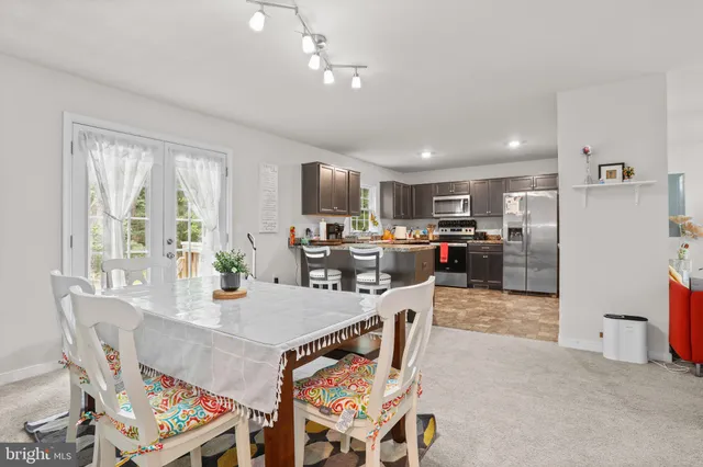 a bedroom that has a bed and a table in it