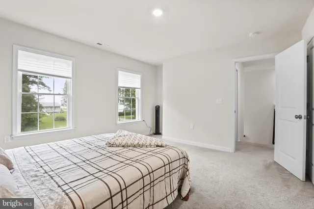 a bedroom with a bed and a shower