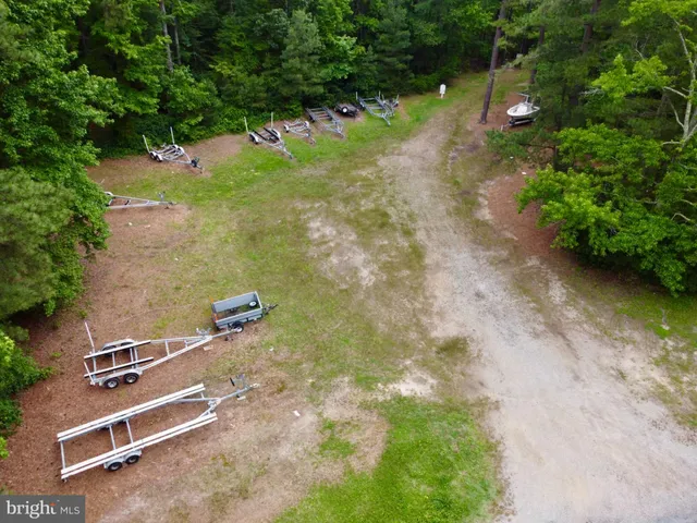 a view of a backyard with a table and chairs