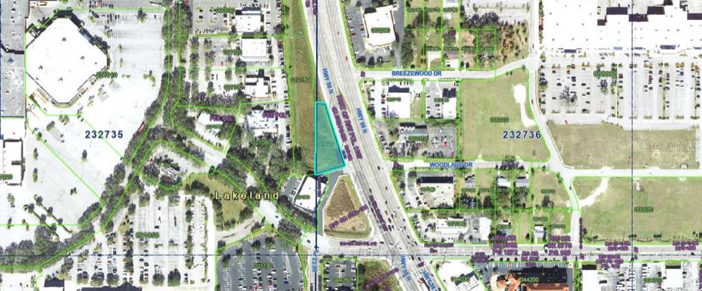 Us-98 Lakeland, FL 33809 - Photo 2 of 3 a multi story building view with large tree