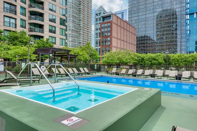 a view of a swimming pool with chairs
