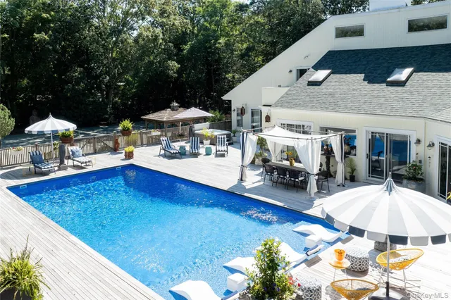 a view of a patio with furniture and a table