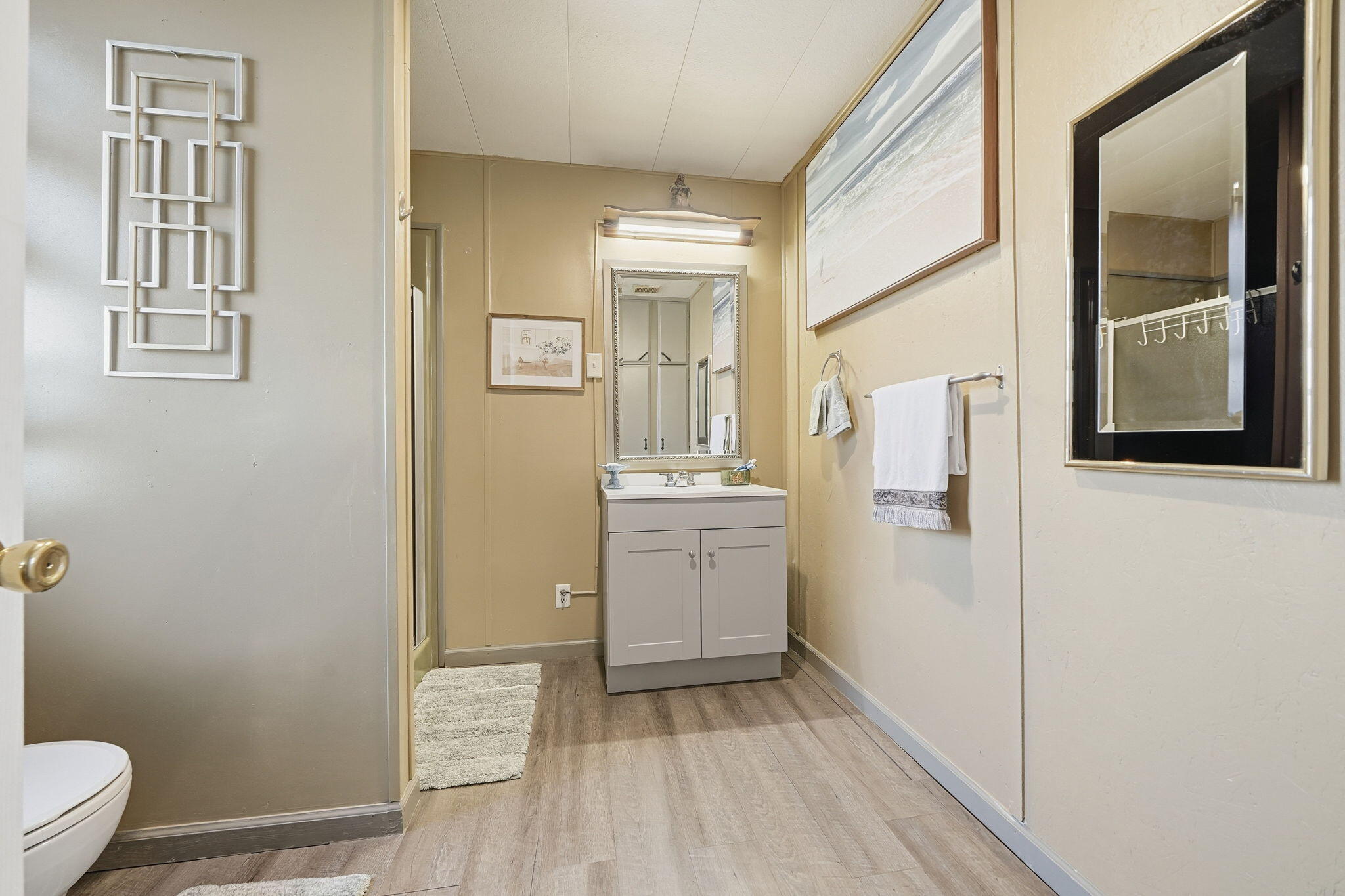 17300 Lassen Avenue Anderson, CA 96007 - Photo 13 of 34 a bathroom with a sink a toilet and a mirror