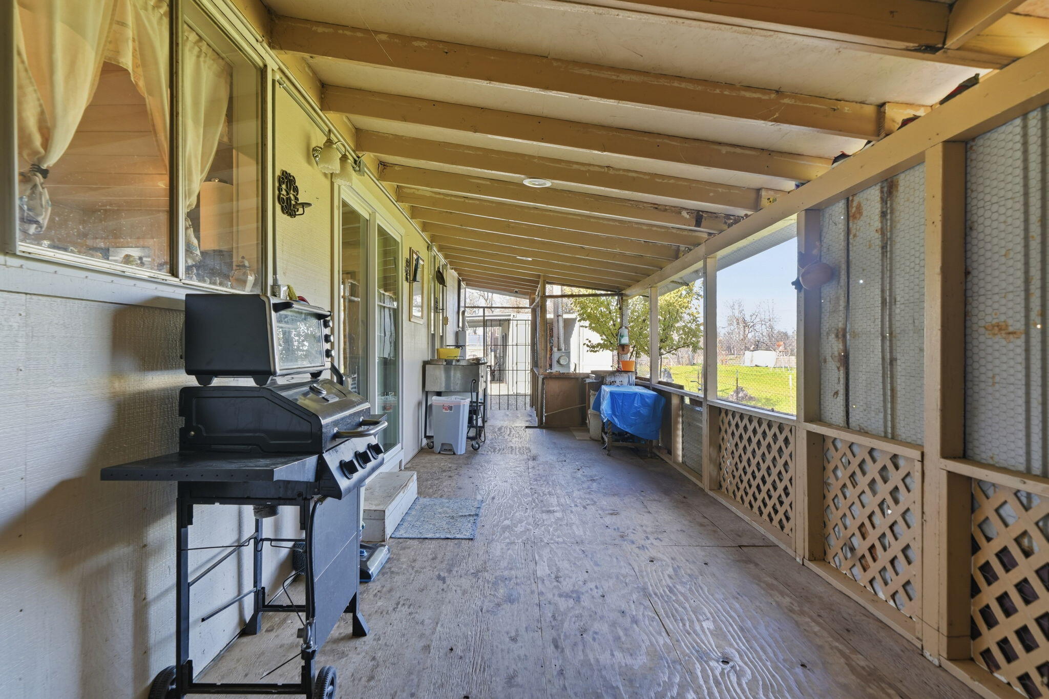 17300 Lassen Avenue Anderson, CA 96007 - Photo 21 of 34 a living room with furniture windows and a wooden floor