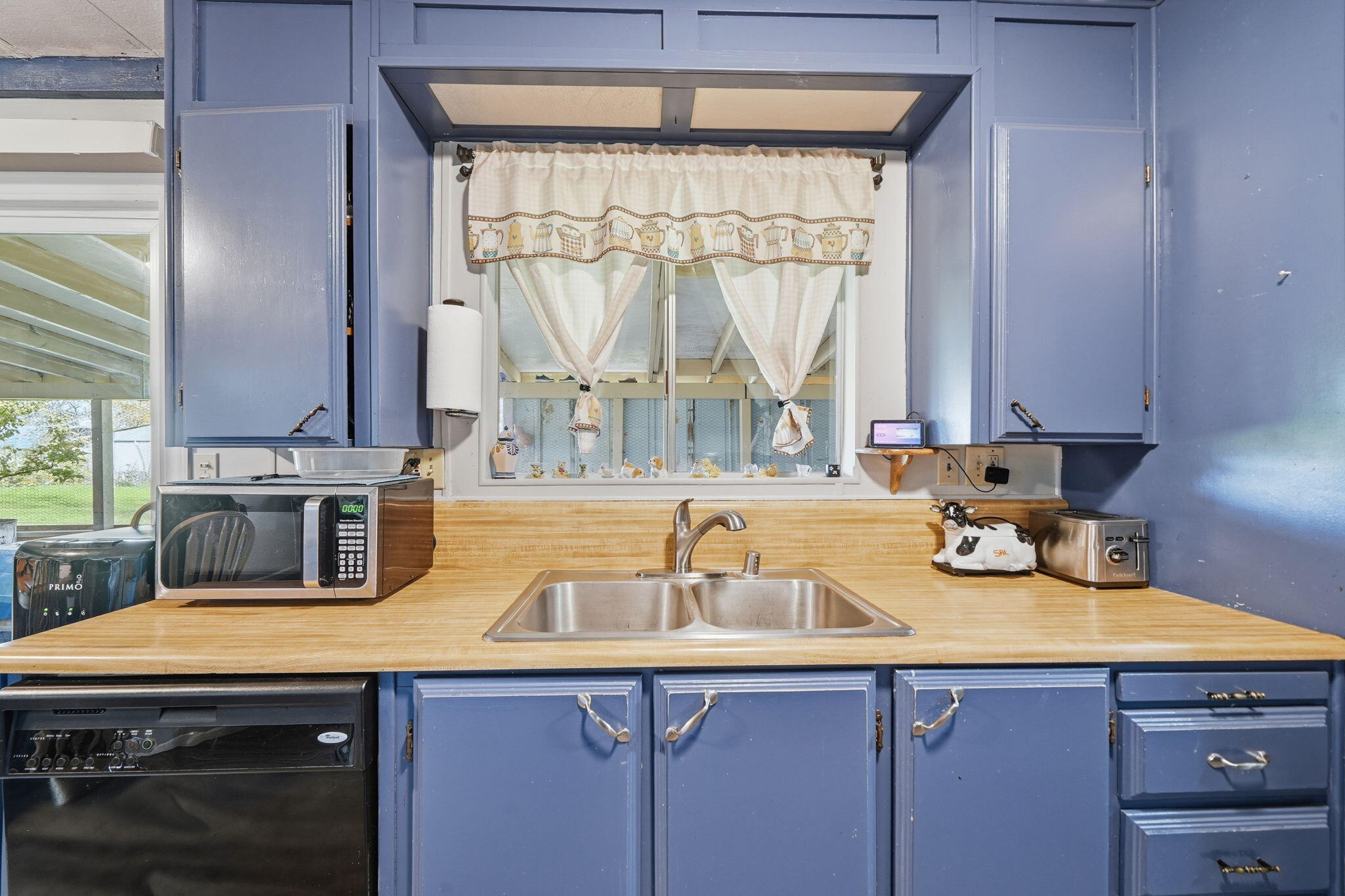 17300 Lassen Avenue Anderson, CA 96007 - Photo 8 of 34 a kitchen with a sink a counter top space and cabinets
