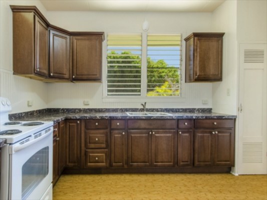 4516 Nene Road Kekaha, HI 96752 - Photo 8 of 20 a kitchen with stainless steel appliances granite countertop a stove a sink and a microwave
