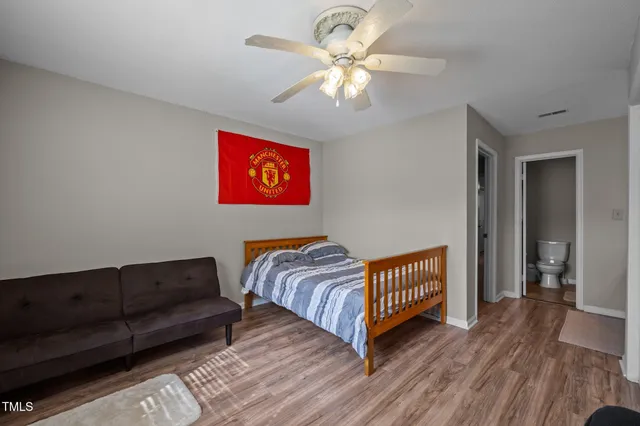 a bedroom with bed and a window