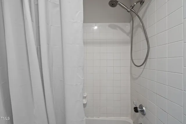 a bedroom with a bed and a desk