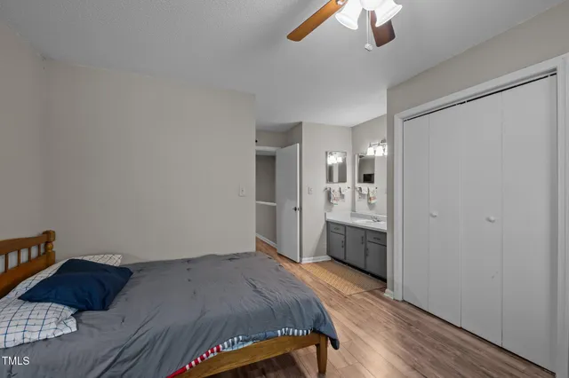 a bathroom with a sink double vanity granite and a mirror