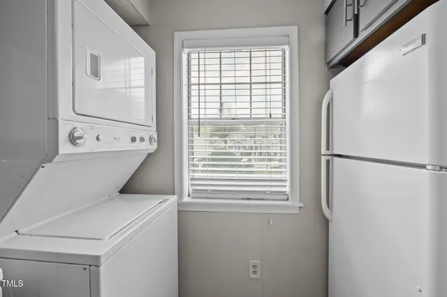 a view of a dining room with furniture and window