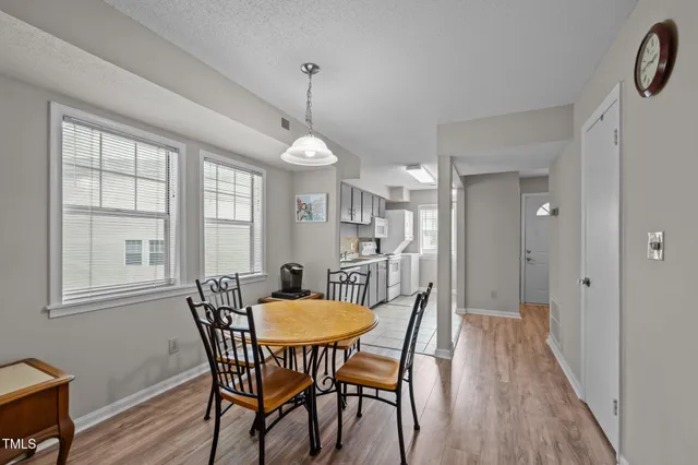 a view of a livingroom with furniture window and wooden floor